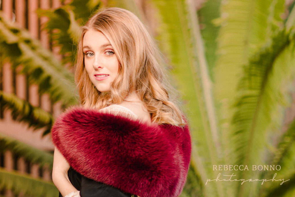 glamour senior session with red fur jacket  and rebecca bonno Photography 