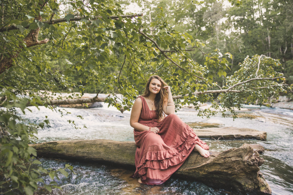 A senior session by a creek in cherokee county at Pooles Mill